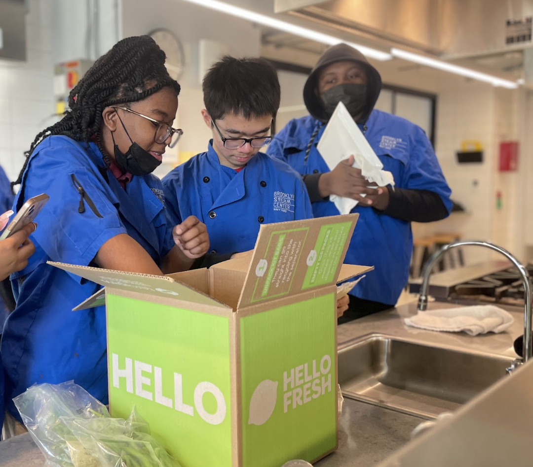 Students from the Food Education Fund prepare for their HelloFresh cook-off.